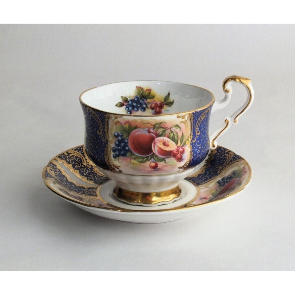 Paragon Cup And Saucer Orchard Fruit Pattern blue gold gilt teacup vintage